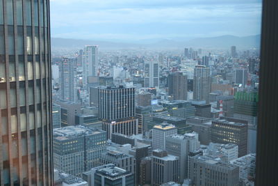 Modern buildings in city against sky