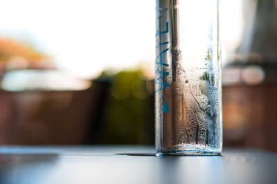 Close-up of water bottle on table