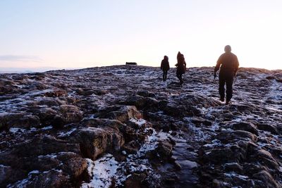 Tourists on rocks at beach
