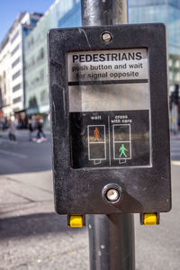Close-up of telephone booth on street