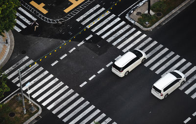 High angle view of cars crossing road