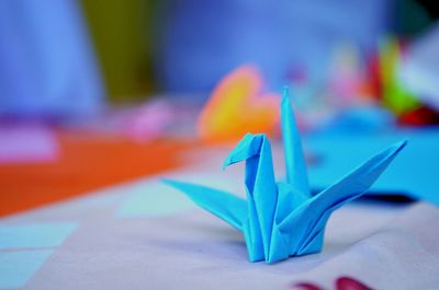 Close-up of paper boat on table