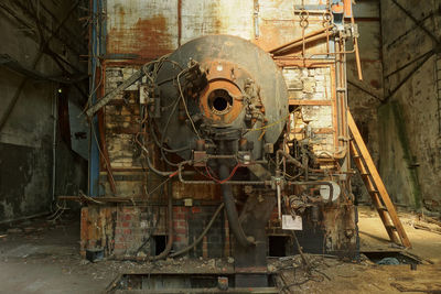 Old machine part in abandoned factory