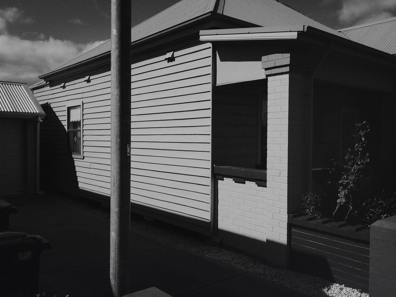 architecture, built structure, building exterior, window, building, sunlight, low angle view, house, sky, residential structure, shadow, residential building, steps, day, door, no people, city, railing, street light, outdoors