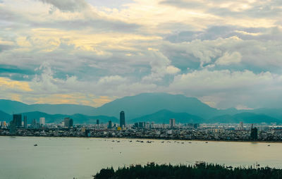 Scenic view of sea and buildings against sky