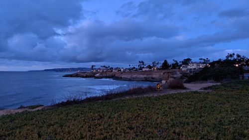 Scenic view of sea against cloudy sky