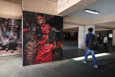 People walking in corridor of building