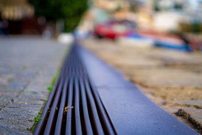 Close-up of railing on footpath