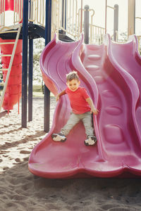 Low angle view of girl playing in playground