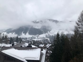 High angle view of houses and trees during winter