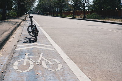 Bicycle parked on road