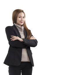 Portrait of young woman against white background