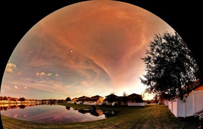 Panoramic shot of houses and trees against sky