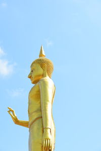 Low angle view of statue against blue sky