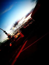 Close-up of red car against blue sky