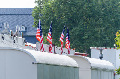 American flags on top of caravans