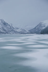 Scenic view of frozen lake against sky