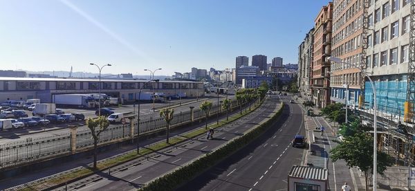 High angle view of street amidst buildings against sky