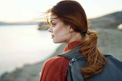 Beautiful woman looking at sea