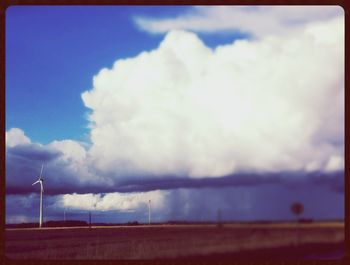 Scenic view of landscape against cloudy sky