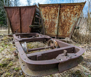 Abandoned vintage car on field