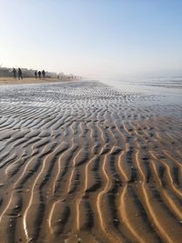 Scenic view of beach against clear sky