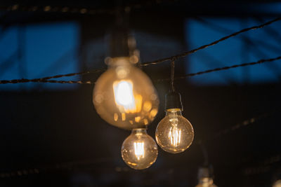 Low angle view of illuminated light bulb