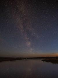 Scenic view of star field against sky at night