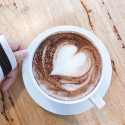 High angle view of coffee cup on table