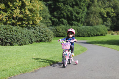 Portrait of boy riding bicycle