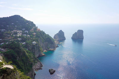 Stunning view of capri island in a beautiful summer day with faraglioni rocks capri, italy