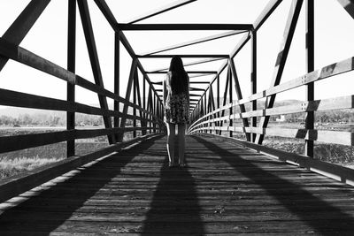 Man walking on footbridge