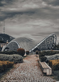 View of bridge against cloudy sky