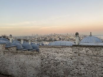 Panoramic view of buildings against sky during sunset