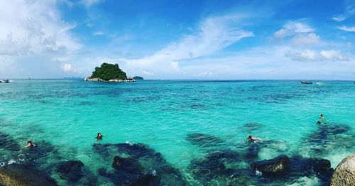 Scenic view of sea against blue sky