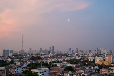 High angle view of buildings against sky during sunset