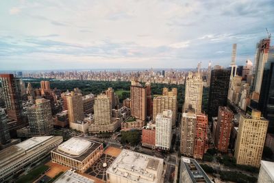 High angle view of modern buildings in city against sky