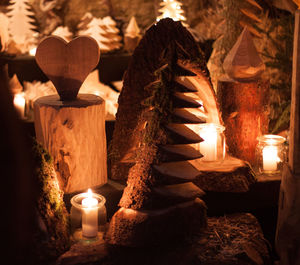 Close-up of burning candles in temple