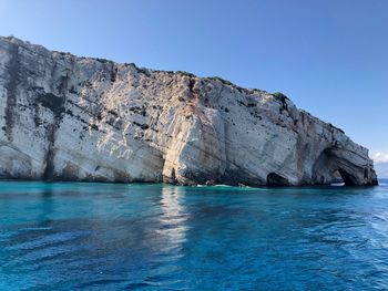 Scenic view of sea against clear blue sky