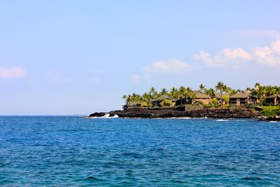 Scenic view of sea and buildings against sky