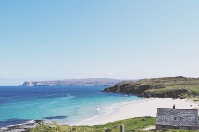 Scenic view of sea against blue sky