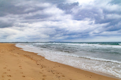 Scenic view of beach against sky