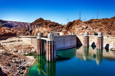 High angle view of dam against blue sky