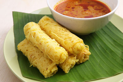 Close-up of roti jala in plate on table