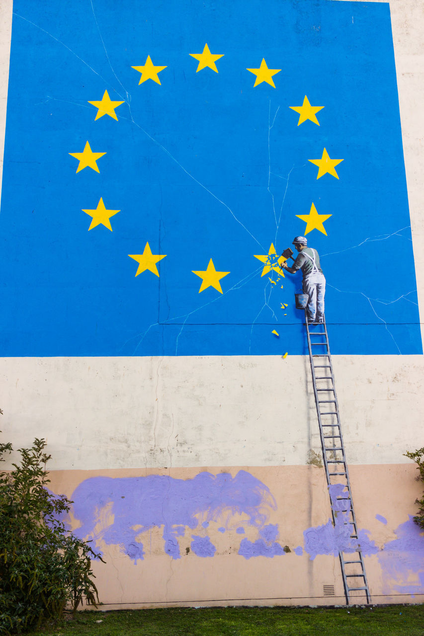 LOW ANGLE VIEW OF FLAG ON WALL