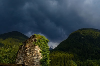 Mysterious ruin against dark cloud