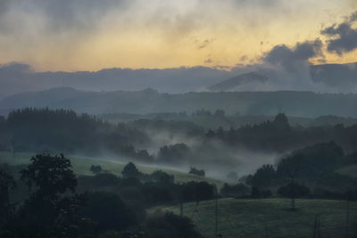 Scenic view of mountains against sky during sunset