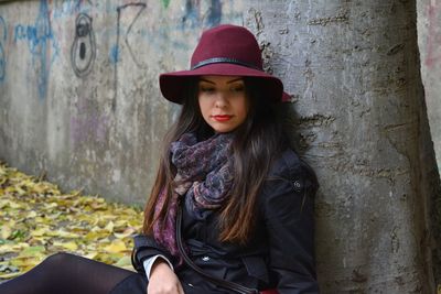 Portrait of young woman wearing hat