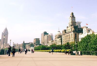 Group of people in city buildings