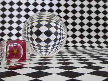 Reflection of glass on tiled floor